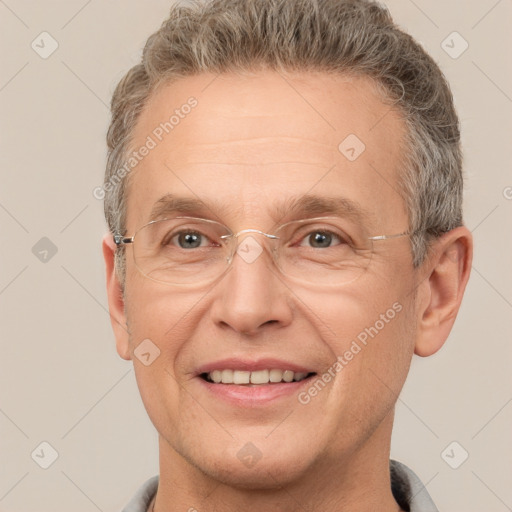 Joyful white middle-aged male with short  brown hair and brown eyes