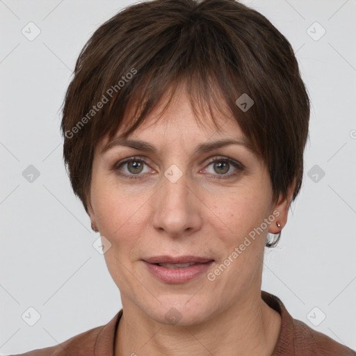 Joyful white adult female with short  brown hair and grey eyes