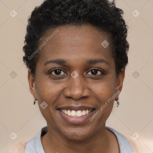 Joyful black young-adult female with short  brown hair and brown eyes