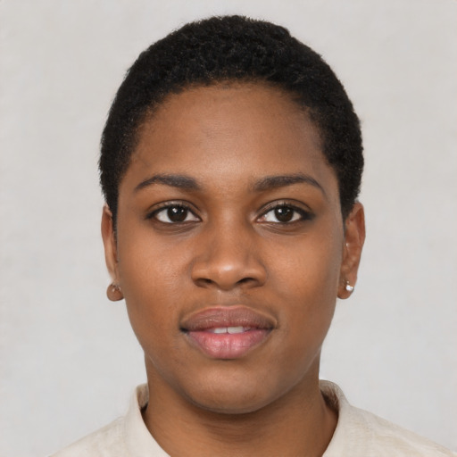 Joyful black young-adult female with short  black hair and brown eyes