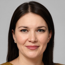 Joyful white young-adult female with medium  brown hair and grey eyes