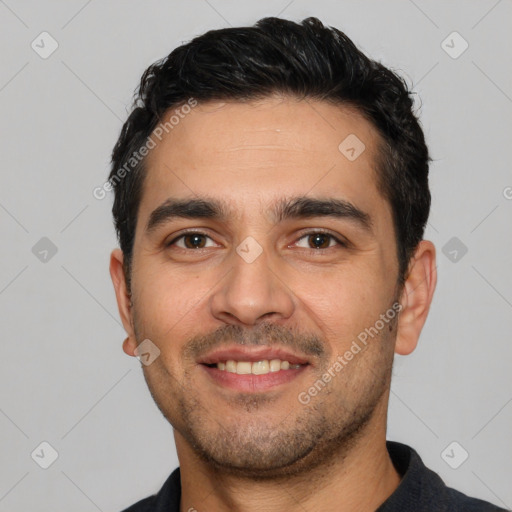 Joyful white young-adult male with short  black hair and brown eyes