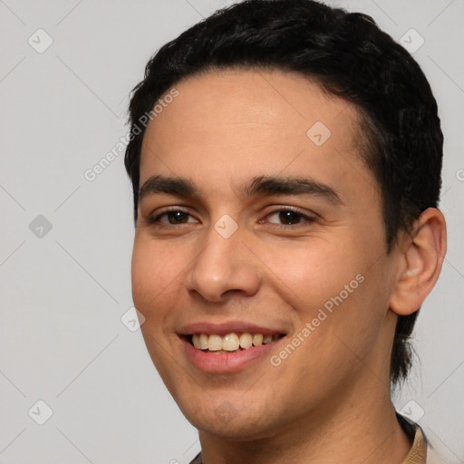 Joyful white young-adult male with short  black hair and brown eyes