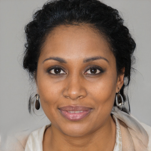 Joyful black young-adult female with medium  brown hair and brown eyes