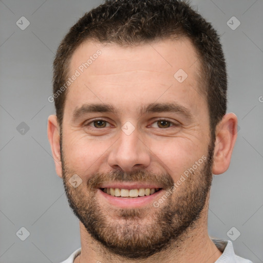 Joyful white young-adult male with short  brown hair and brown eyes