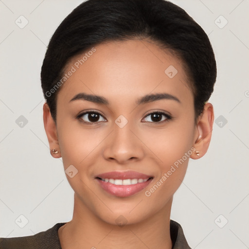 Joyful latino young-adult female with short  brown hair and brown eyes