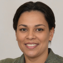 Joyful white adult female with short  brown hair and brown eyes