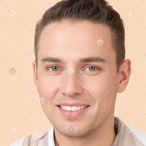 Joyful white young-adult male with short  brown hair and brown eyes