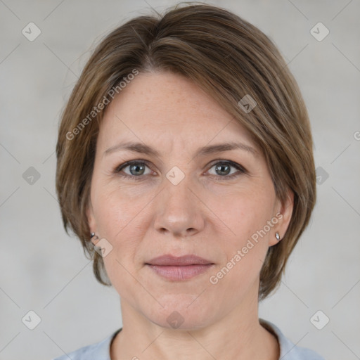 Joyful white adult female with medium  brown hair and grey eyes