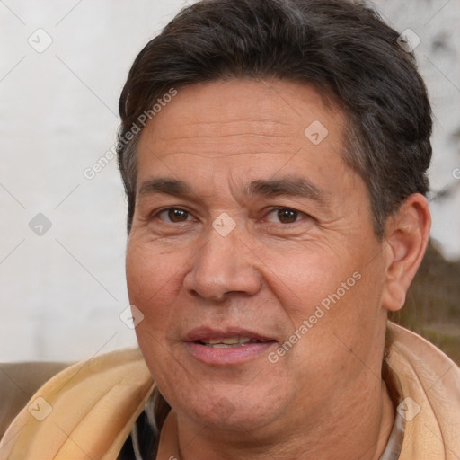 Joyful white middle-aged male with short  brown hair and brown eyes