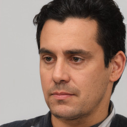 Neutral white adult male with short  black hair and brown eyes