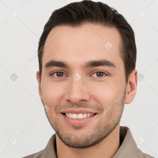 Joyful white young-adult male with short  brown hair and brown eyes