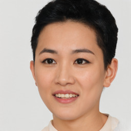 Joyful asian young-adult female with short  black hair and brown eyes