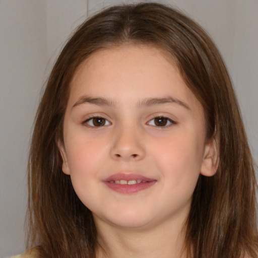 Joyful white child female with long  brown hair and brown eyes