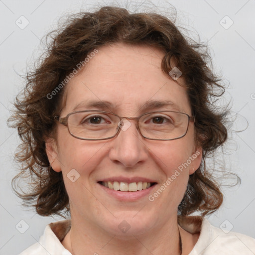 Joyful white adult female with medium  brown hair and blue eyes