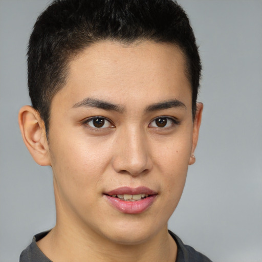Joyful latino young-adult male with short  brown hair and brown eyes