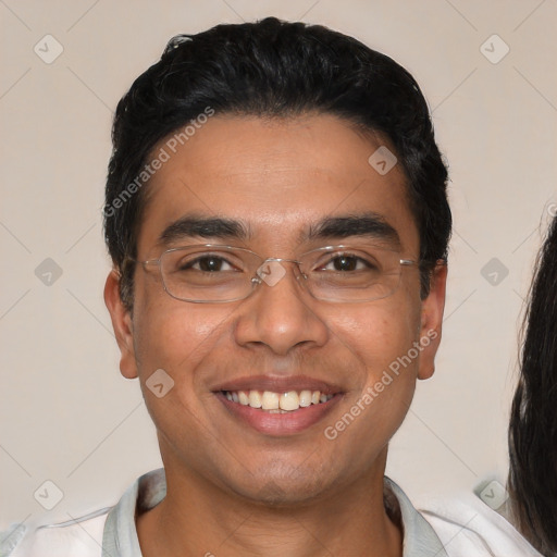 Joyful white young-adult male with short  black hair and brown eyes