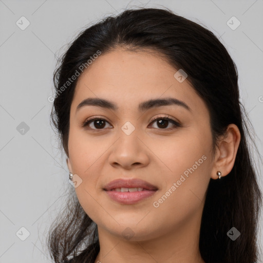 Joyful latino young-adult female with long  brown hair and brown eyes