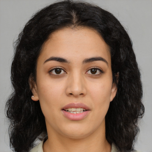 Joyful asian young-adult female with long  black hair and brown eyes