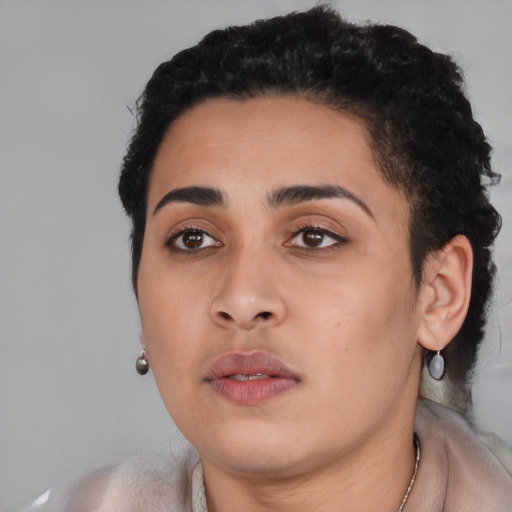 Neutral latino young-adult female with short  black hair and brown eyes