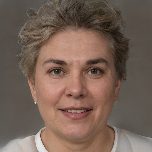 Joyful white adult female with short  brown hair and brown eyes