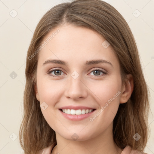 Joyful white young-adult female with medium  brown hair and green eyes