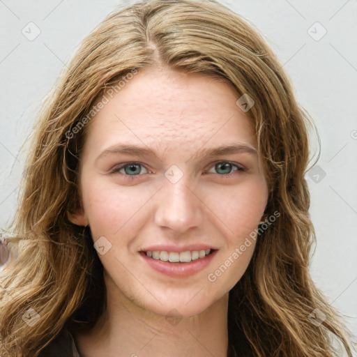 Joyful white young-adult female with long  brown hair and blue eyes