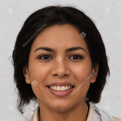 Joyful latino young-adult female with medium  brown hair and brown eyes