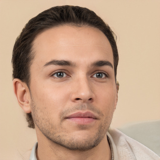 Neutral white young-adult male with short  brown hair and brown eyes