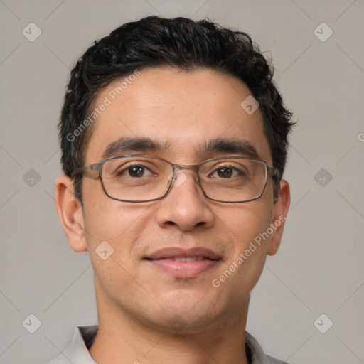 Joyful white adult male with short  black hair and brown eyes