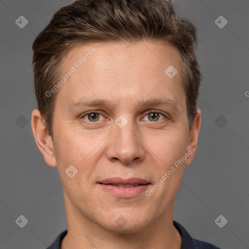 Joyful white adult male with short  brown hair and grey eyes