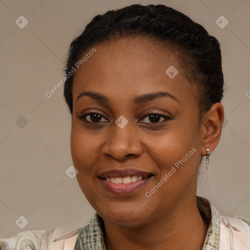 Joyful black young-adult female with short  brown hair and brown eyes