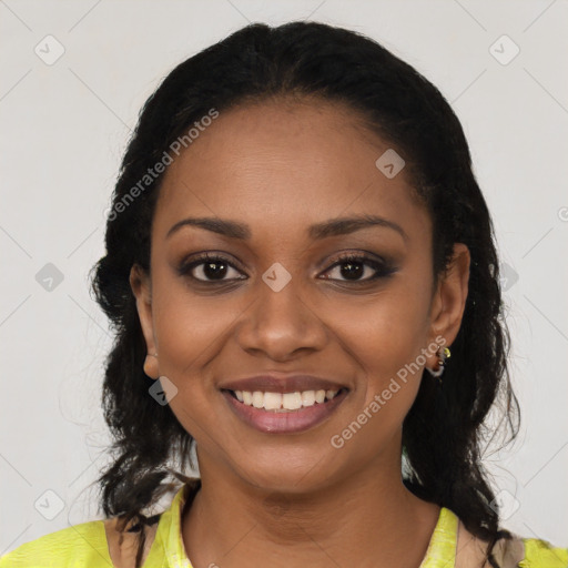 Joyful black young-adult female with long  black hair and brown eyes