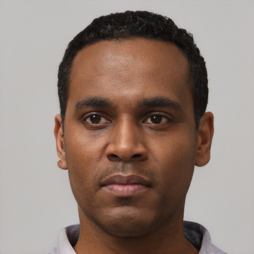 Neutral black young-adult male with short  black hair and brown eyes