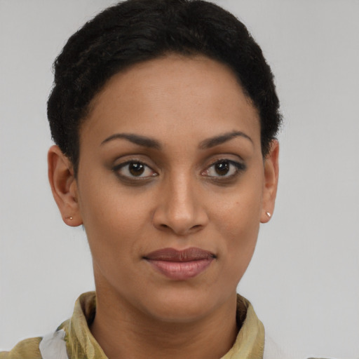 Joyful latino young-adult female with short  brown hair and brown eyes