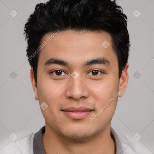 Joyful asian young-adult male with short  black hair and brown eyes