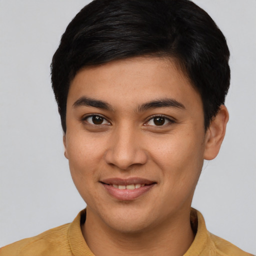 Joyful asian young-adult male with short  brown hair and brown eyes