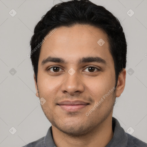 Joyful latino young-adult male with short  black hair and brown eyes