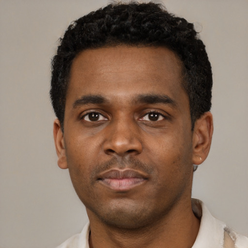 Neutral black young-adult male with short  black hair and brown eyes