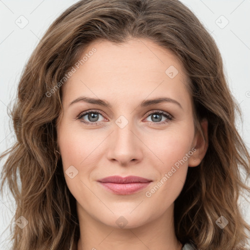 Joyful white young-adult female with long  brown hair and green eyes