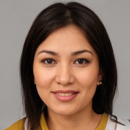 Joyful white young-adult female with medium  brown hair and brown eyes