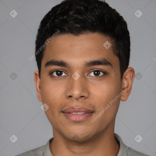 Joyful latino young-adult male with short  black hair and brown eyes