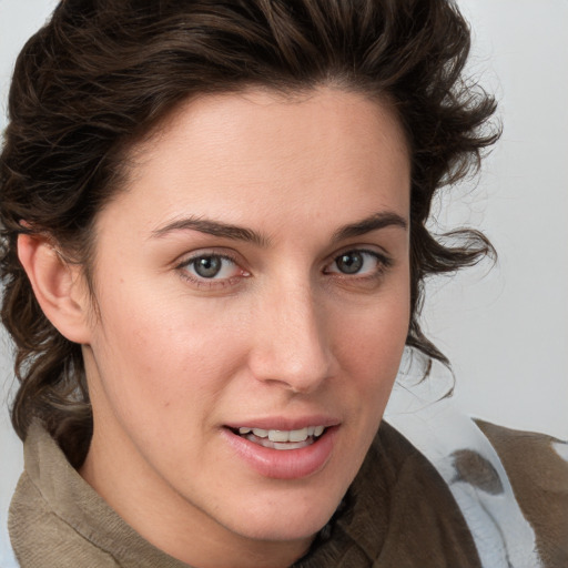 Joyful white young-adult female with medium  brown hair and green eyes