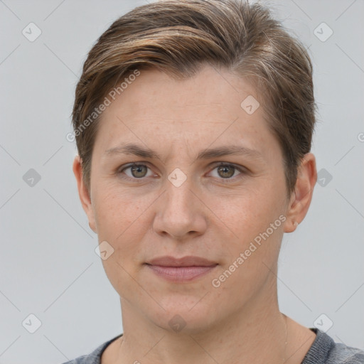 Joyful white adult female with short  brown hair and grey eyes