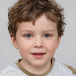 Joyful white child male with short  brown hair and brown eyes