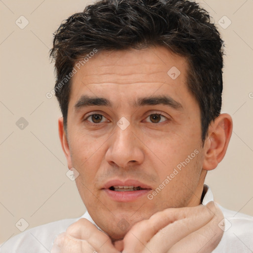 Joyful white adult male with short  brown hair and brown eyes