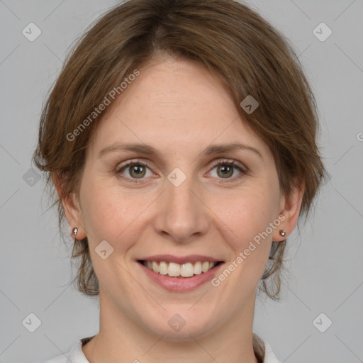 Joyful white young-adult female with medium  brown hair and green eyes