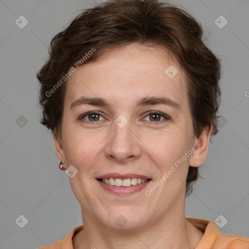 Joyful white adult female with medium  brown hair and brown eyes