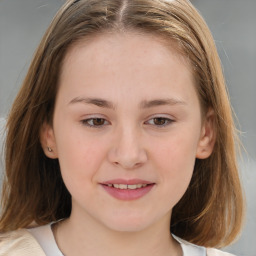 Joyful white child female with medium  brown hair and brown eyes