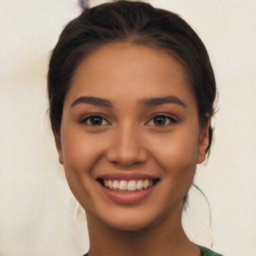 Joyful latino young-adult female with long  brown hair and brown eyes